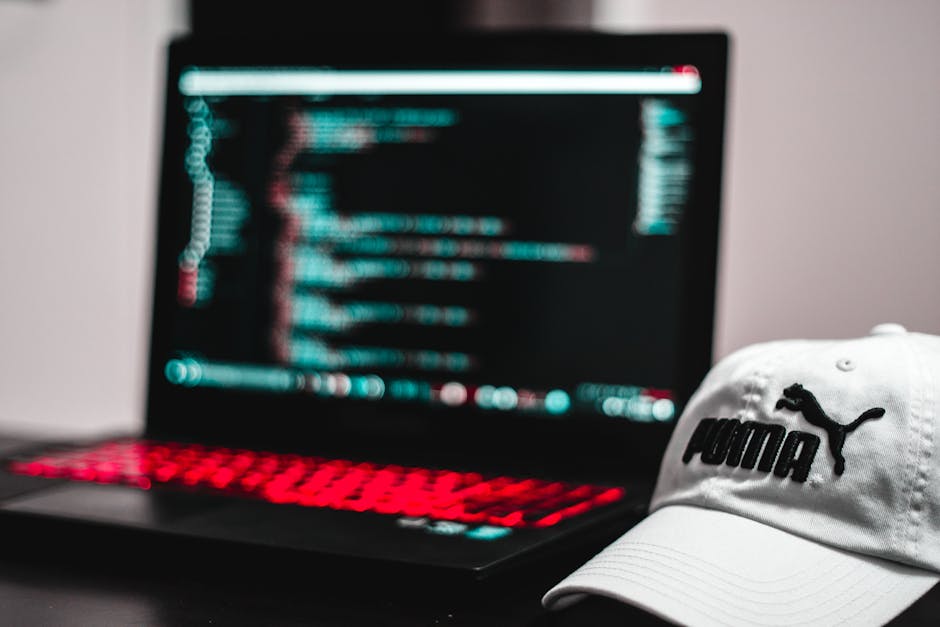 The image displays a computer screen showing lines of CSS code in a code editor with a dark background. The text includes various style properties such as margin, padding, border, and background color